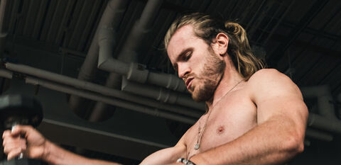 Man doing weights in Hyrox class at BXR City every weekend